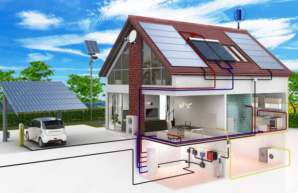 Ein Haus mit Solarflächen auf dem Dach und ein Carport mit Solarflächen